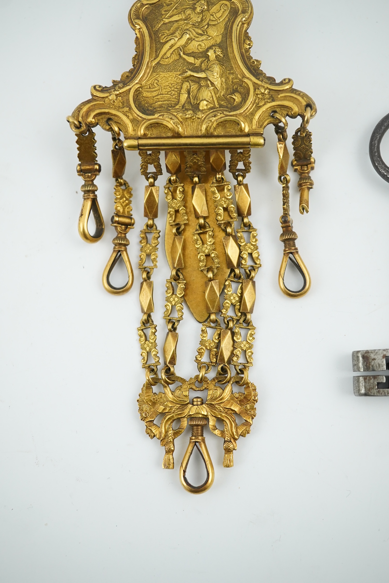 A late 18th century German gilt metal chatelaine and a steel key, chaterlaine 14cm long. Condition - a link is missing on one chain